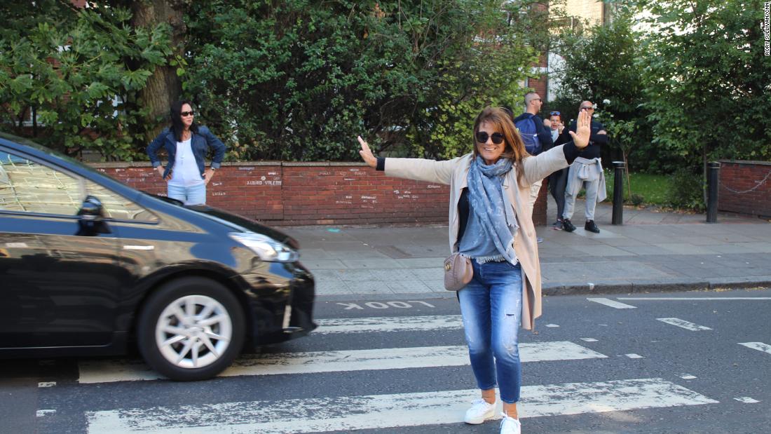 Karen Abramson, a photographer who grew up in Liverpool, poses mid-traffic. 