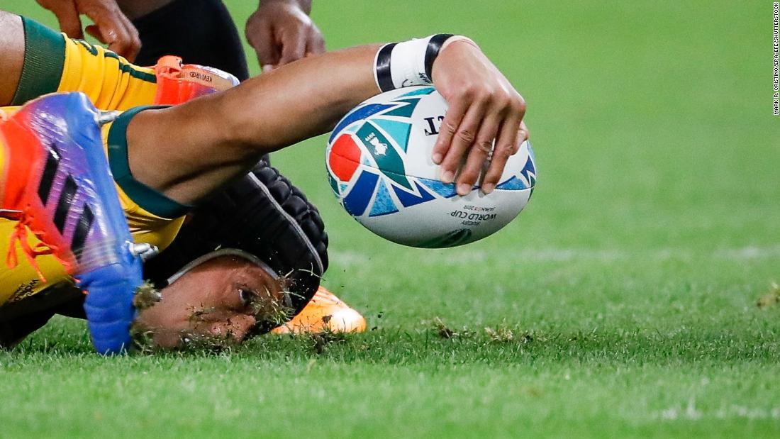 Christian Lealiifano of Australia holds on to the ball during the Rugby World Cup match between Australia and Fiji in Sapporo, Japan, on September 21.