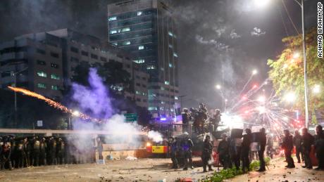 Indonesian riot police fire tear gas to disperse student protesters during a clash outside parliament in Jakarta, Indonesia, on September 24, 2019. 