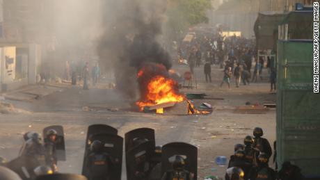 Riot police face off with protesters in Makassar, Sulawesi on September 24, 2019, as demonstrations in Jakarta and other cities take place for a second day in a row against the government&#39;s proposed change to its criminal code laws. 