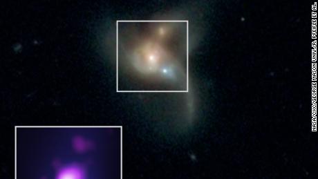 These three black holes are going to crash into each other