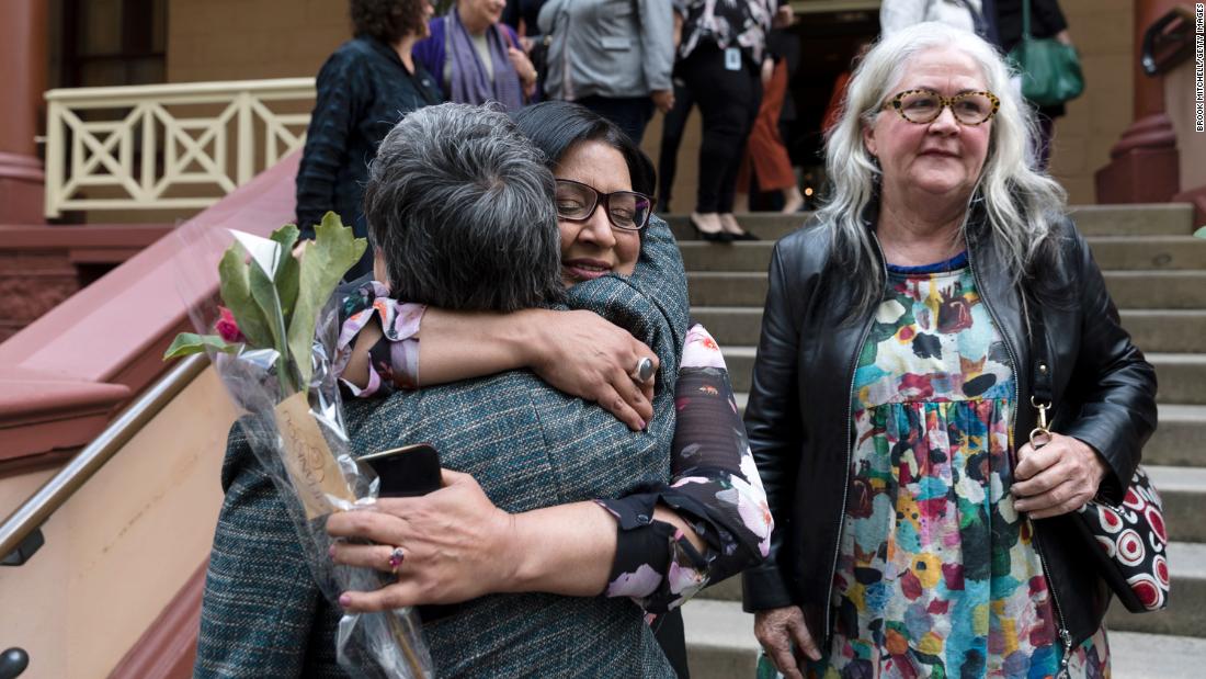 (L-R) MP's Jenny Leong and Mehreen Faruqi embrace outside NSW Parliament after the passing of the bill to decriminalise abortion on September 26, 2019 in Sydney, Australia. After two weeks of debate, the Upper House of the NSW parliament passed legislation to decriminalise abortion on Wednesday night. The Reproductive Health Care Reform Bill 2019 - which was introduced by Independent Alex Greenwich and co-sponsored by 15 MPs from across all sides of politics - now returned to the NSW Legislative Assembly this morning to be passed into law. Rhe bill removes abortion from the Crimes Act and will regulate it as a medical procedure, with extra safeguards for abortions after 22 weeks' gestation. Abortions had been on the criminal code in NSW since 1900 with a penalty of 10 years in prison.