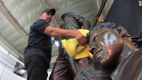 Sculptor Dan Medina polishes the Braceros monument in his Los Angeles studio before its installation. 