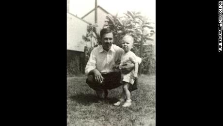 Turner is seen with his father, Ed, at approximately 10 to 14 months old.