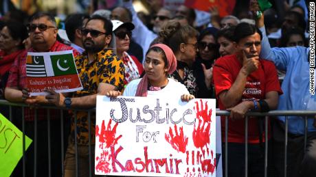 People gather during a protest in solidarity with the people of Kashmir outside the United Nations.