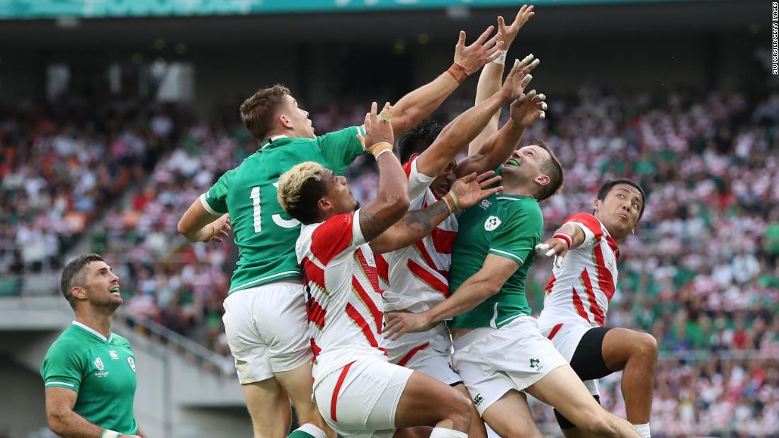 Ireland players Gary Ringrose (l) and Jack Carty (r) compete for a high ball during the Rugby World Cup 2019 Group A game between Japan and Ireland.