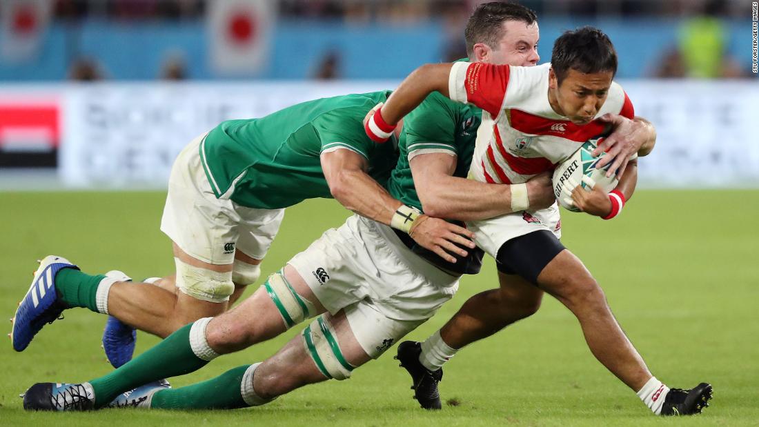 Yutaka Nagare of Japan is tackled by James Ryan of Ireland during the hard-fought encounter