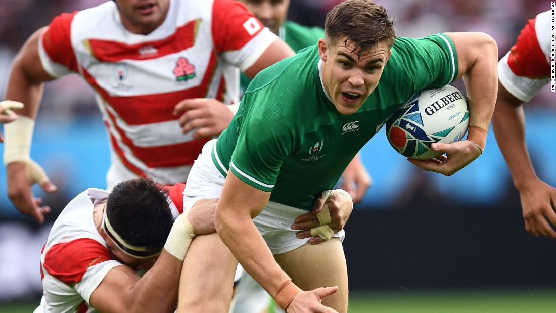 Ireland&#39;s centre and first half try scorer Garry Ringrose is tackled by Japan&#39;s lock Luke Thompson as the action hots up in Shizuoka.