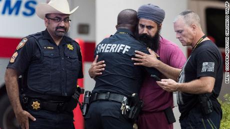 Mourners gather outside Memorial Hermann Hospital in Houston after Dhaliwal was killed.