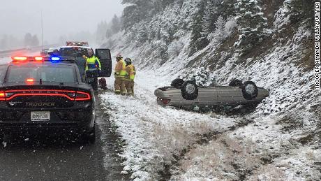 Montana Highway Patrol Trooper Amanda Villa caught this image of a car flipped over in harsh weather in Montana. 