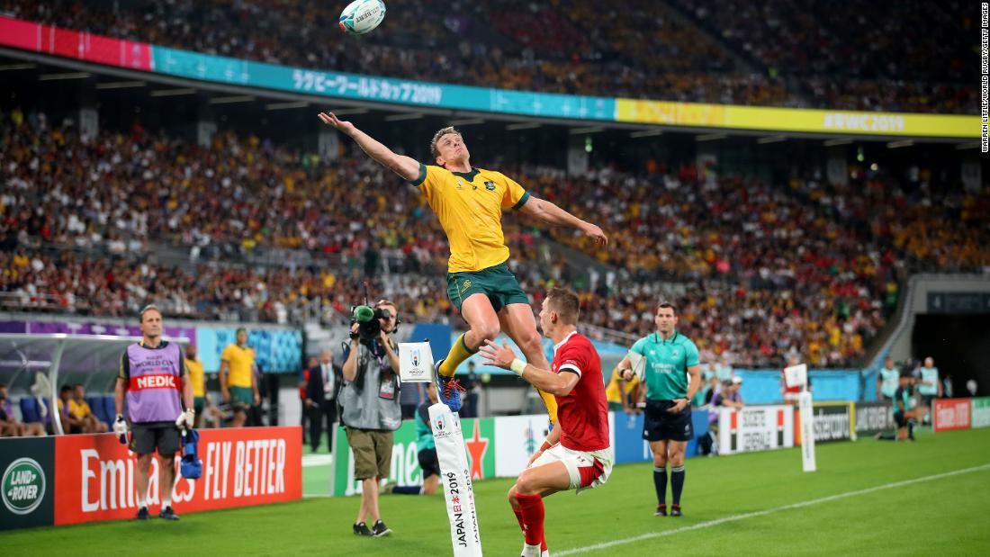 Dane Haylett-Petty of Australia jumps for the ball under pressure from Liam Williams of Wales.