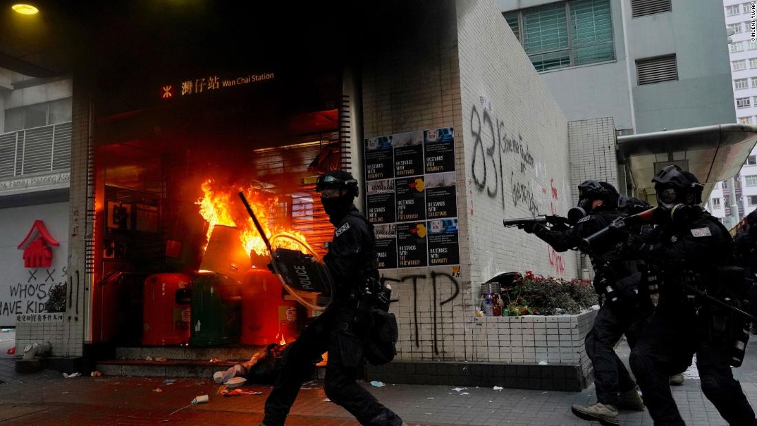 Riot police try to disperse protesters on September 29.