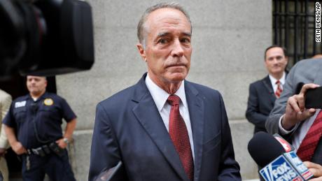 In this September 12, 2019 file photo, U.S. Rep. Chris Collins, R-N.Y., speaks to reporters as he leaves the courthouse after a pretrial hearing in his insider-trading case, in New York.