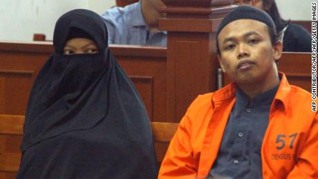 Dian Yulia Novita with her husband Nur Solikin during their trial at East Jakarta District Court in Jakarta, on August 23, 2017. The ex-nanny was sentenced to seven-and-a-half years jail for her involvement in an Islamic State-inspired plot to carry out a suicide bomb attack on the presidential palace in Jakarta.