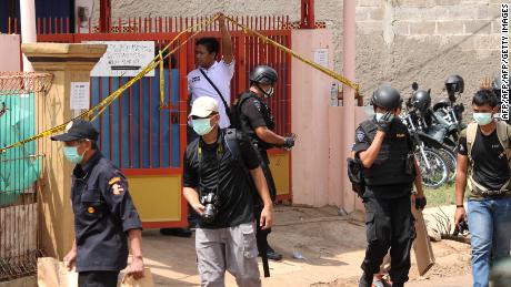 Indonesian police examines a boarding house where the three-kilogram bomb encased in a pressure cooker was discovered in Bekasi, West Java on December 11, 2016. One of the four militants arrested used to work as a domestic helper in Singapore.