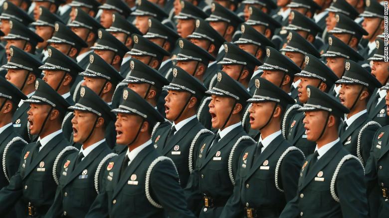 Soldiers of the People&#39;s Liberation Army shout during the rehearsal of the parade early morning on October 01, 2019, in Tiananmen Square.