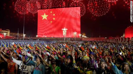 Fireworks explode over Tiananmen Square as performers mark the 70th anniversary of the People&#39;s Republic of China in Beijing on October 1.