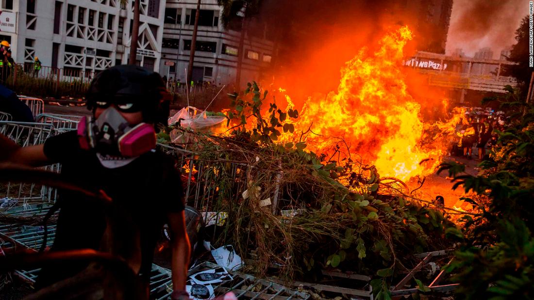 A fire lit by protesters burns in the Sha Tin district of Hong Kong.