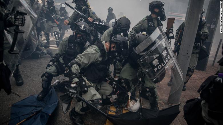 Police tackle and arrest  protesters during clashes in Hong Kong&#39;s Wan Chai district on October 1, 2019.