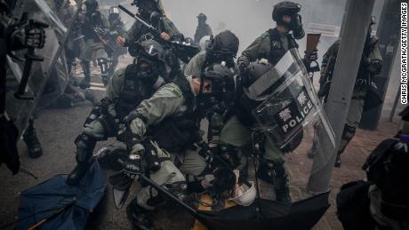 Police tackle and arrest protesters during clashes in Hong Kong&#39;s Wan Chai district on October 1, 2019.