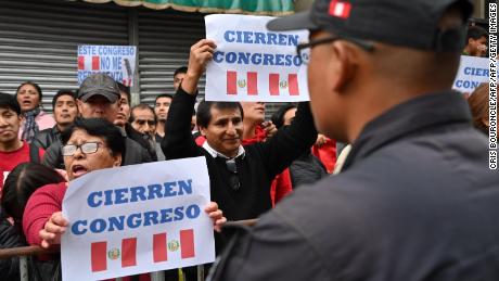 Protesters demand the dissolution of the congress and demonstrate against lawmakers in Lima on September 30, 2019.