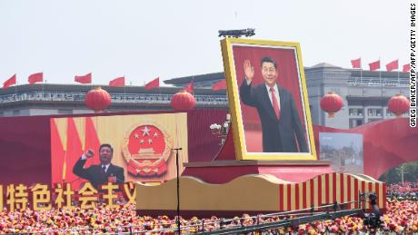 A float with a giant portrait of Chinese President Xi Jinping passes by Tiananmen Square during the National Day parade in Beijing on October 1.