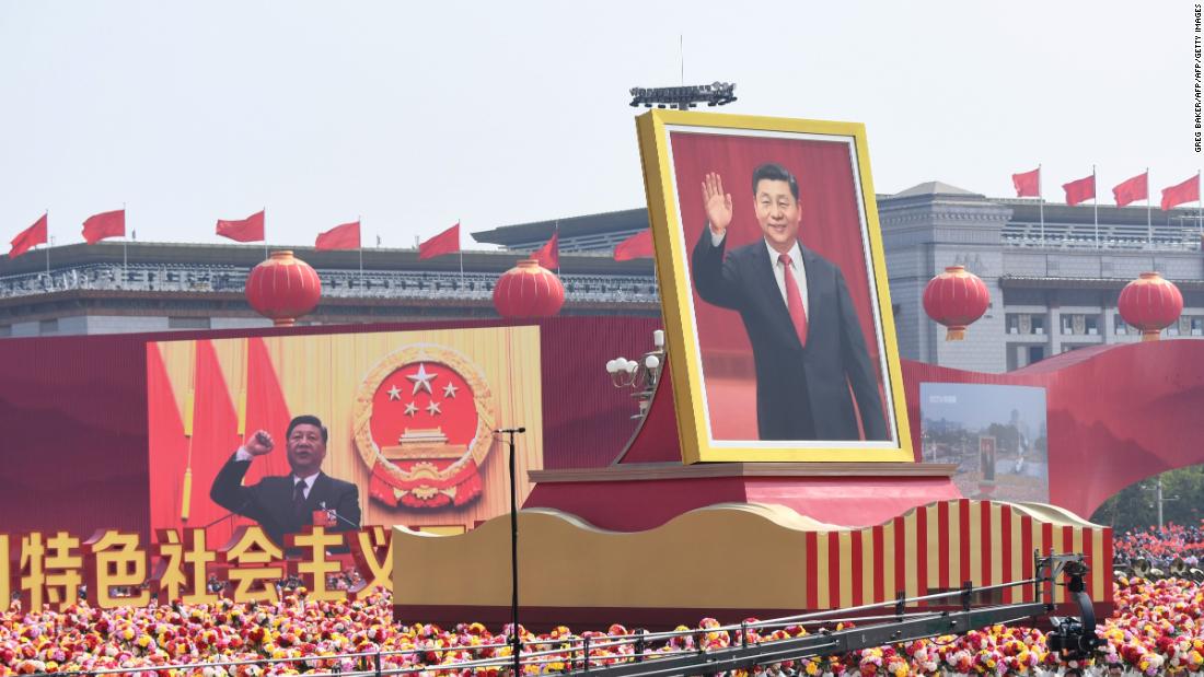 A float with a giant portrait of Chinese President Xi Jinping passes by Tiananmen Square during the National Day parade in Beijing on October 1.