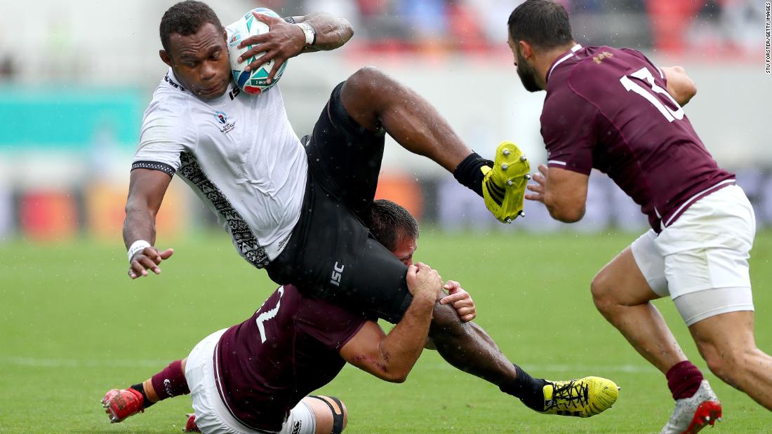 Fiji&#39;s Leone Nakarawa is tackled by Merab Sharikadze of Georgia.
