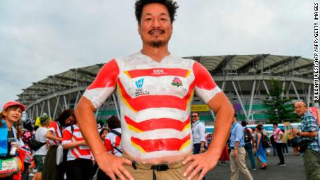 A Japan fan has the national team&#39;s jersey painted on as he arrives for the Japan 2019 Rugby World Cup Pool A match between Japan and Ireland at the Shizuoka Stadium Ecopa in Shizuoka on September 28, 2019. (Photo by William WEST / AFP)        (Photo credit should read WILLIAM WEST/AFP/Getty Images)