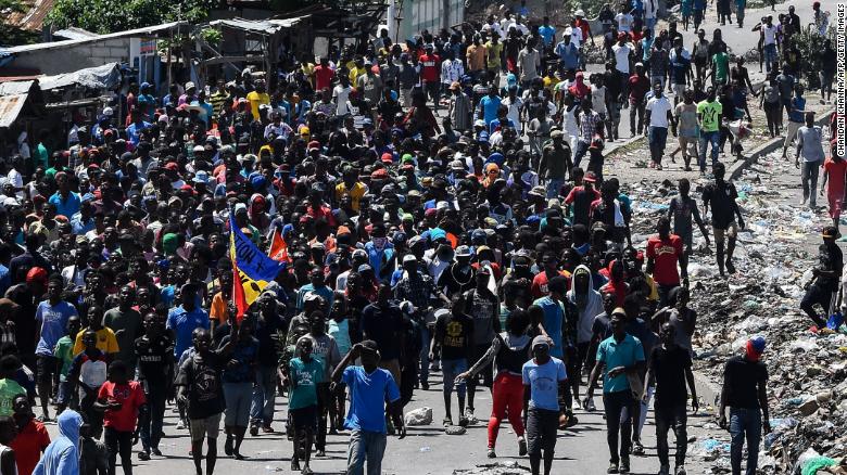 People march in Cite Soleil during the anti-government protest on September 27, 2019. 