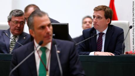 Vox party spokesman Javier Ortega Smith (front) speaks as Madrid Mayor Jose Luis Martinez Almeida (right) listens in during a plenary session of the Town Hall&#39;s constitution.