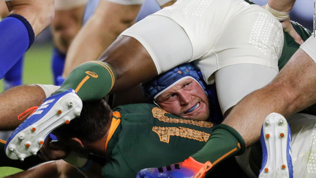 Italy&#39;s hooker Luca Bigi is caught at the bottom of a ruck.