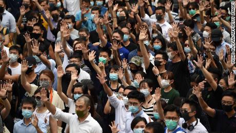 Pro-democracy demonstrators hold up their hands to symbolise their five demands during a protest against an expected government ban on protesters wearing face masks at Chater Garden in Hong Kong on October 4, 2019. - Hong Kong&#39;s government was expected to meet October 4 to discuss using a colonial-era emergency law to ban pro-democracy protesters from wearing face masks, in a move opponents said would be a turning point that tips the financial hub into authoritarianism. (Photo by Mohd RASFAN / AFP) (Photo by MOHD RASFAN/AFP via Getty Images)