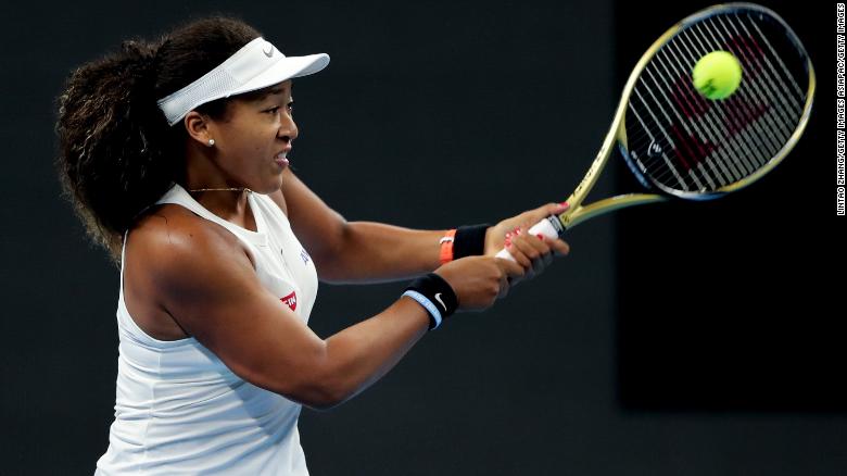 Naomi Osaka returns a shot against Bianca Andreescu of Canada in Beijing.
 