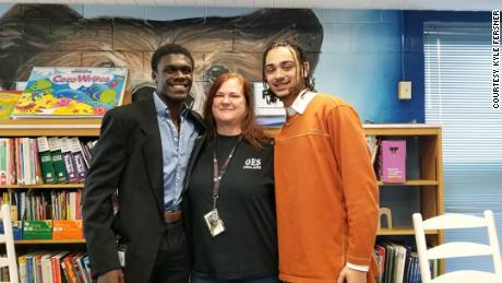 Kyle Fersner (on the right) with his fellow teaching cadet and their former fifth grade teacher. 