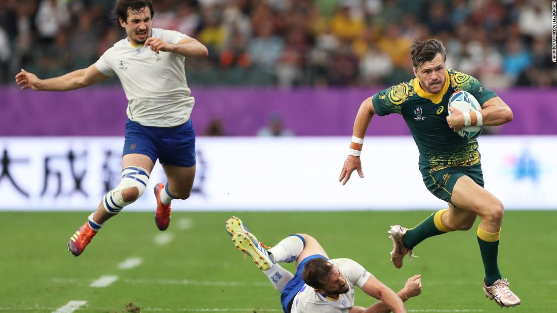 Adam Ashley-Cooper of Australia makes a break during his side&#39;s 45-10 win over Uruguay in Pool D at the Oita Stadium.