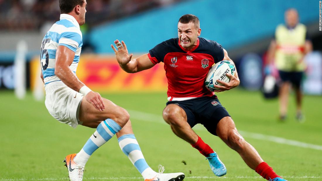 Jonny May of England takes on Emiliano Boffelli of Argentina. May scored the opening try for his side.