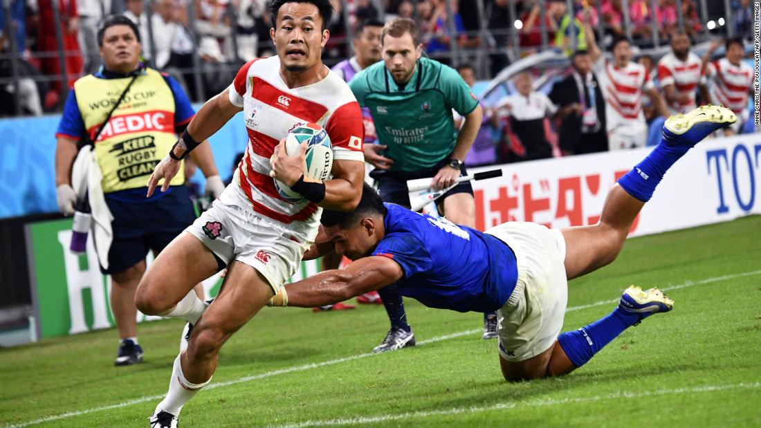 Japan&#39;s wing Kenki Fukuoka charges clear to score the third try for the Brave Blossoms. 