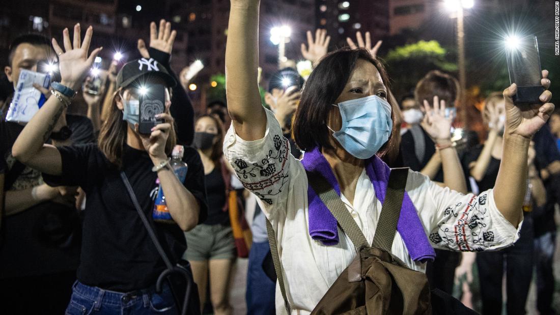 People protest the ban against masks on Saturday, October 5.