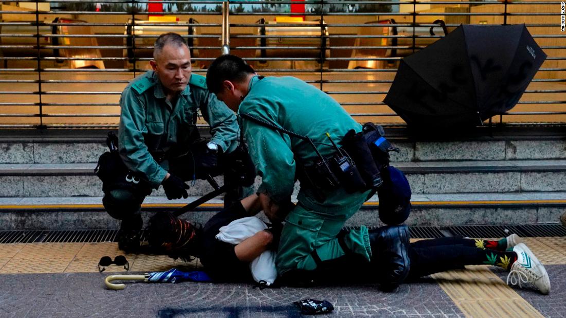 Police detain a protester on October 5.