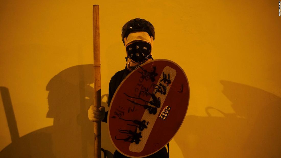 A masked protester stops for a portrait in Hong Kong on Sunday, October 6.