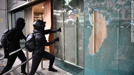 Protesters vandalize the Cheung Sha Wan local government offices in Hong Kong on Sunday.