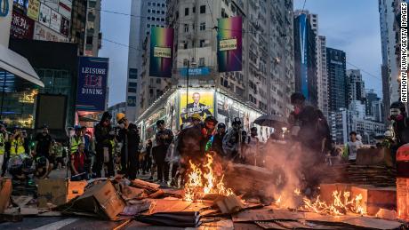 Pro-democracy protesters set a barricade on fire in Causeway Bay district, Hong Kong, on Sunday.