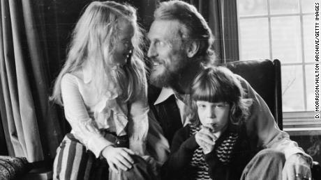 Ginger Baker pictured at home with his children in December 1974.