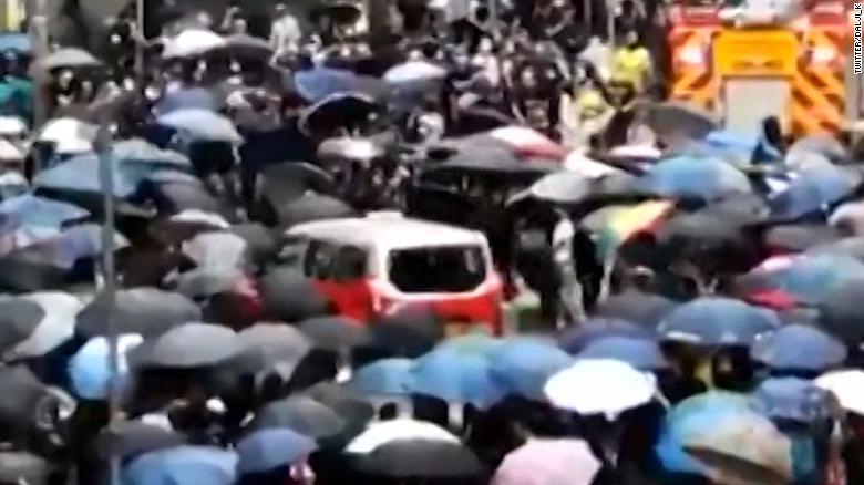 Taxi driver attacked after slamming into crowd of protesters 