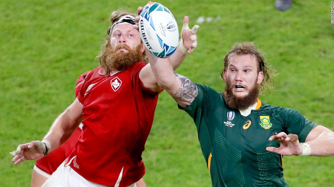 Canada&#39;s Evan Olmstead (left) and South Africa&#39;s RG Snyman compete for the ball.
