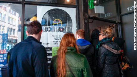 Customers wait in line to enter Chicago&#39;s Shuga Records on Record Store Day on April 13, 2019.