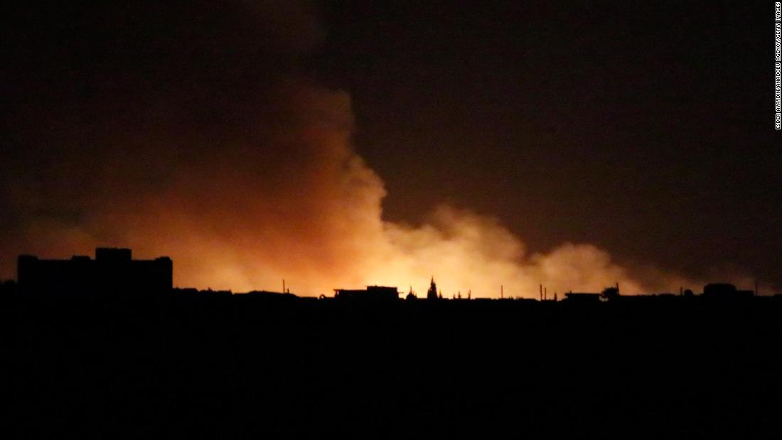 Smoke is seen in Tal Abyad, Syria, on October 9.