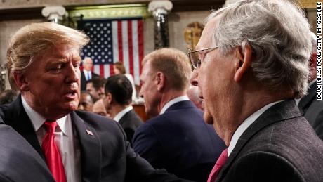 WASHINGTON, DC - FEBRUARY 5: U.S. President Donald Trump shakes hands with Senate Majority Leader Mitch McConnell (R-KY) as he departs the chamber of the U.S. House of Representatives after delivering the State of the Union address at the U.S. Capitol Building on February 5, 2019 in Washington, DC. President Trump's second State of the Union address was postponed one week due to the partial government shutdown. (Photo by Doug Mills-Pool/Getty Images)