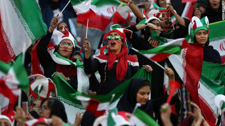 Iranian women cheer during a soccer match between their national team and Cambodia in the 2022 World Cup qualifier at the Azadi Stadium in Tehran, Iran, Thursday, Oct. 10, 2019.